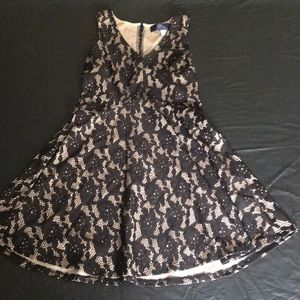 Black with nude under tone. Great night dress